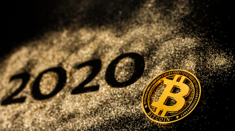 Happy New Year 2020 . Creative Collage of numbers two and zero made up the year 2020. Beautiful sparkling Golden number 2020 and bitcoin on black background for design